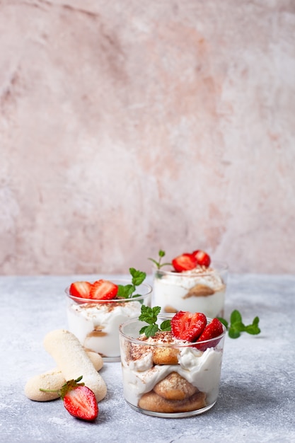 Tiramisu in a glass with fresh strawberries