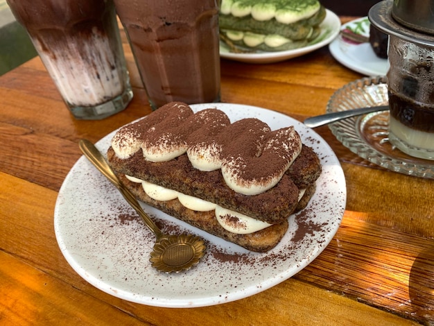 Tiramisu Italian layered dessert with mascarpone cream garnished with cocoa powder