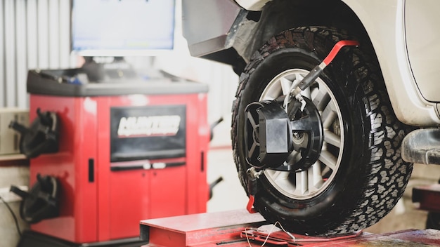 Tire being serviced on a work platform in a repair shop