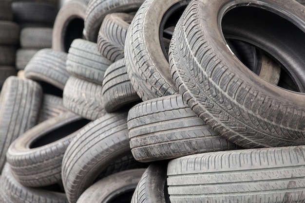 tire, maintenance, service and motor transport concept - close up of wheel tyres