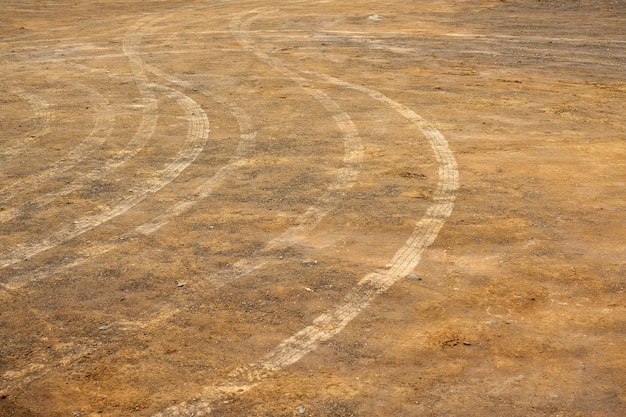 Tire tread marks on the ground as a backdrop