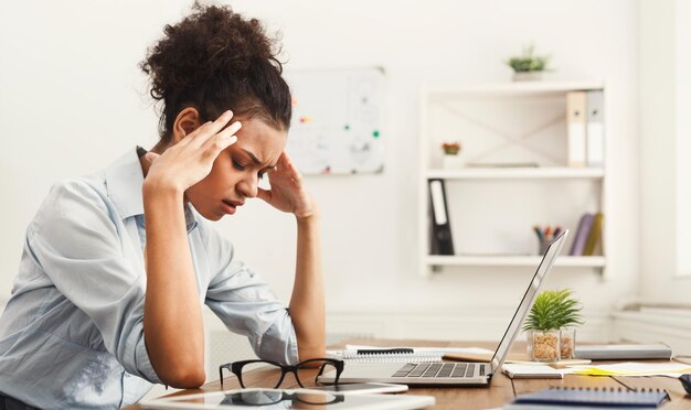 Tired business woman at office copy space