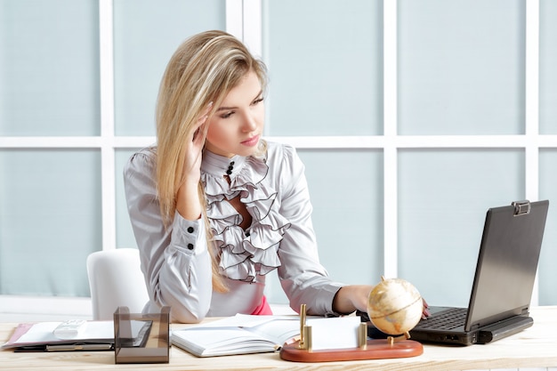 Tired business woman working in the office