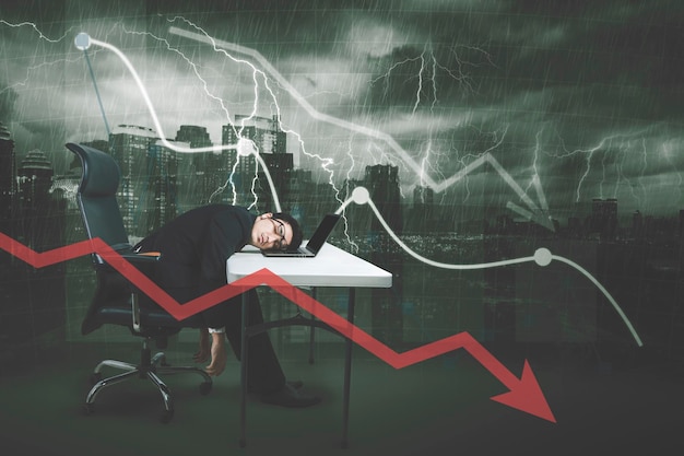 Photo tired businessman sleeping with declining chart