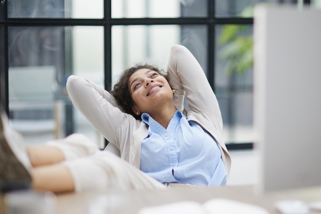 Tired businesswoman sleeping with closed eyes at workplace