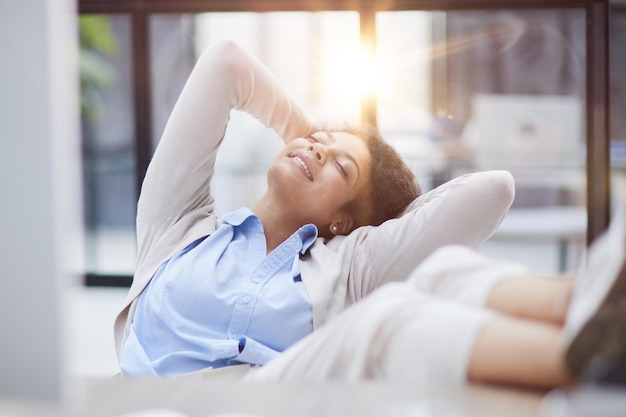 Tired businesswoman sleeping with closed eyes at workplace