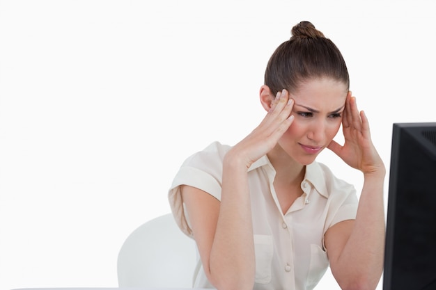 Tired businesswoman using a computer