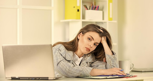 Tired businesswoman with laptop elegant woman with document folder online office worker formal fashion style stylish woman work on notebook girl follow dress code wait feedback from client