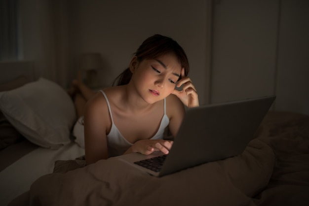 Tired businesswoman working overtime at home at night