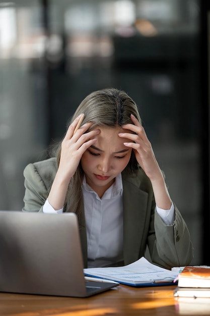 Tired caucasian business woman with headache at office feeling sick at work copy space