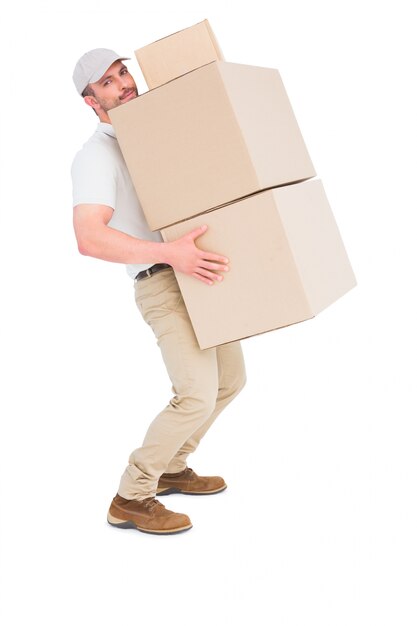 Photo tired delivery man carrying stack boxes