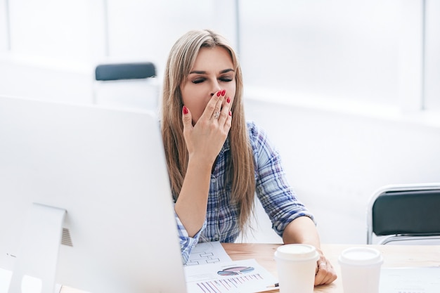 Tired employees working with financial documents in the office office weekdays