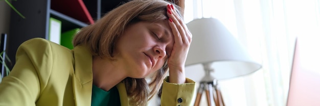 Photo tired lonely businesswoman at workplace in office financial mistake and overtime concept