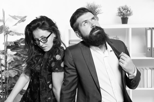 Tired man with beard and sexy woman Young coworkers Businesspeople Teamwork Business couple in office Formal fashion dress code Overtime Tired from work Tired office worker feeling tired