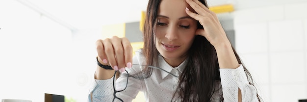 Tired overworked woman suffer with headache on workplace in office