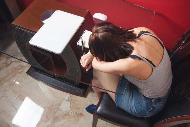 Tired and overworked woman. Young girl at home