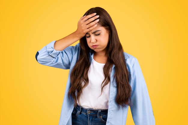 Tired sad european teenager lady suffer from fatigue mistake headache
