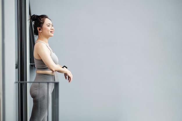 Tired Sportswoman Breathing Fresh Air