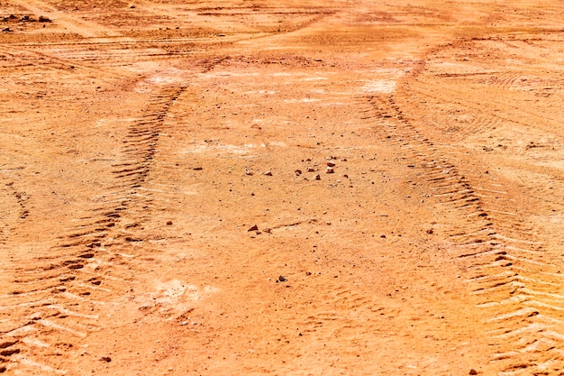 Photo tired track on the ground. perspective view.