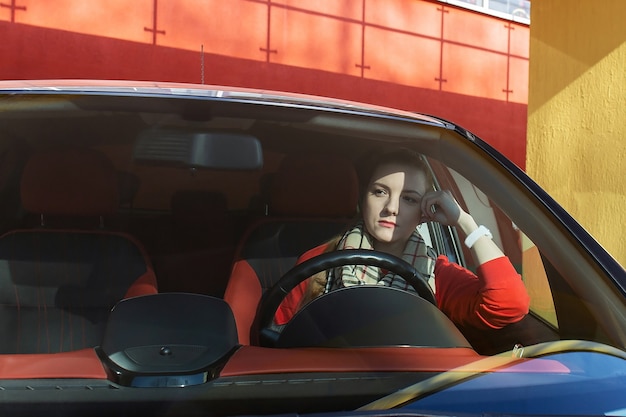 The tired woman in a car, upset