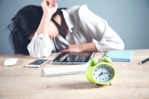 Tired woman in office desk