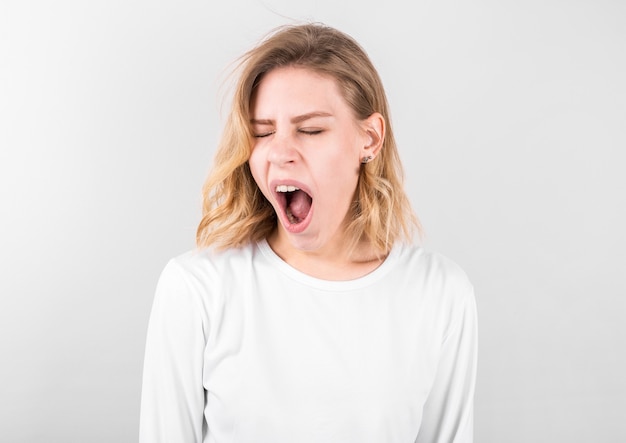 Tired woman yawning