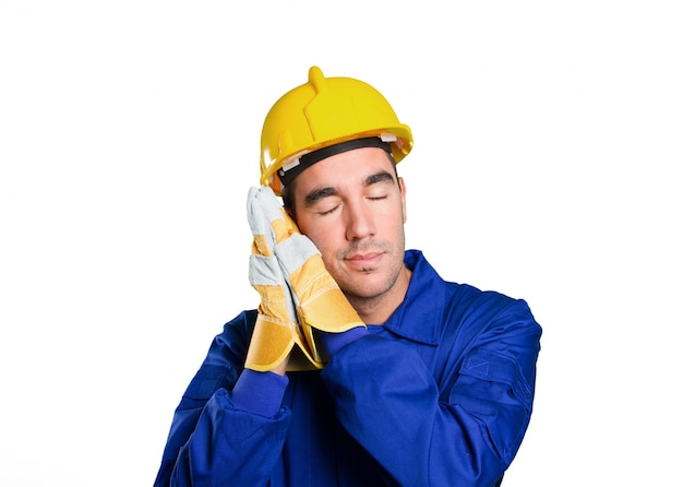 Tired worker sleeping on white background