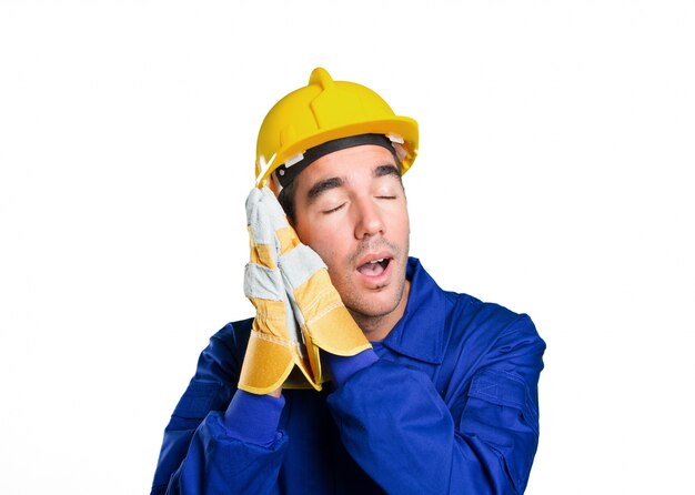 Tired worker sleeping on white background