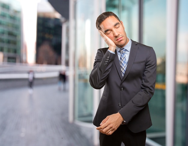 Tired young businessman relaxing