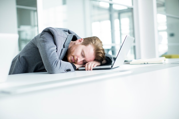 Tired young man in the office