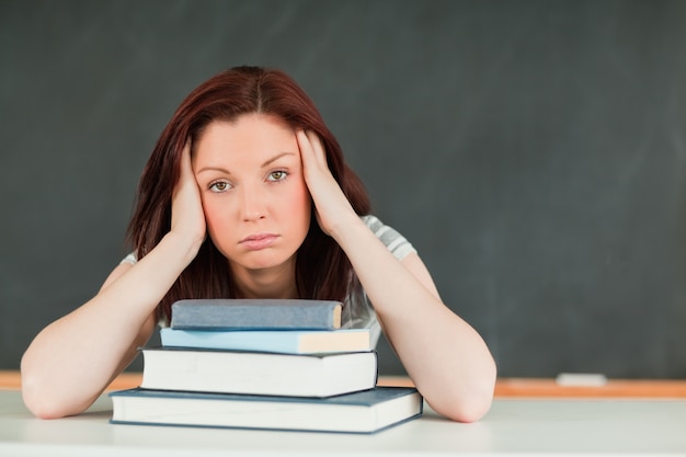 Tired young student in a classroom