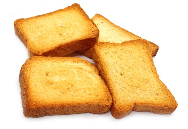 Toast biscuits close up over white