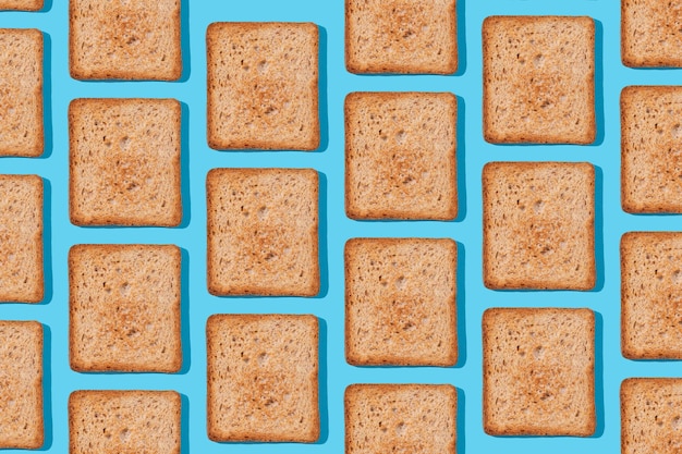 Toast pattern on blue background Creative food concept morning breakfast brunch concept