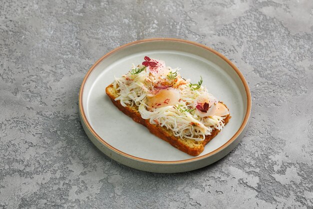 Photo toast with crab meat and fresh vegetables