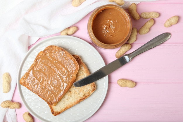Toast with peanut butter on the table