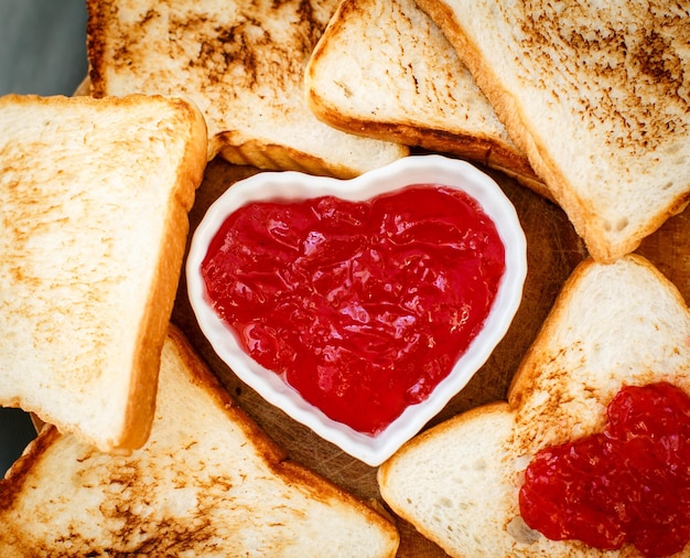 Toast with strawberry jam in a heart shape Valentine's Day