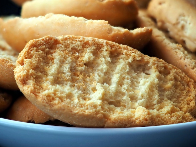 Toasted bread in a blue ceramic bowl Close up