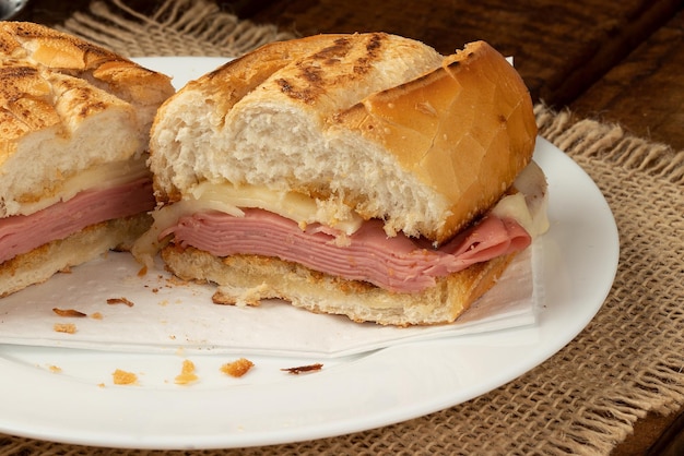 Toasted bread stuffed with melted cheese and mortadella Selective focus