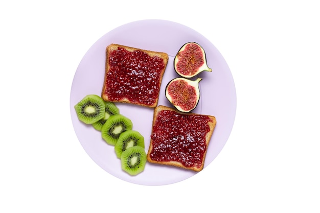 Photo toasted bread with homemade jam on plate isolated on a white background top view sandwiches with raspberry confiture fresh fig and kiwi fruits for breakfast flat composition