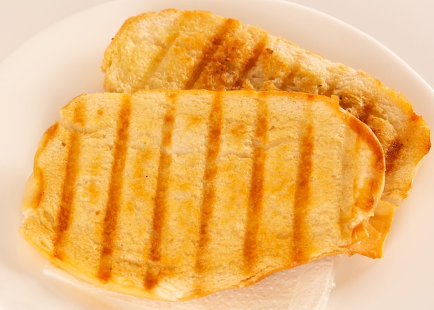 Toasted bread with melted butter Brazilian breakfast food Close Up View