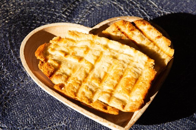 Toasted bread with melted butter Brazilian breakfast food heart shaped