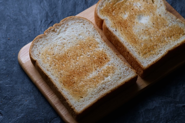 Toasted bread on wooden board