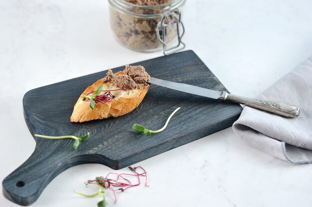 Toasted sandwich of toast with pate and greens