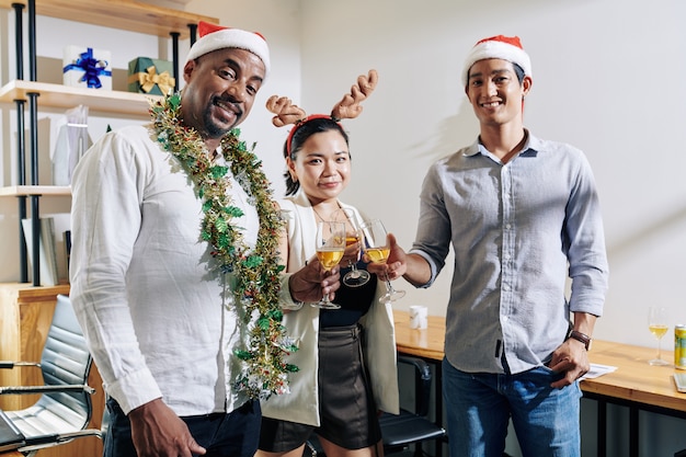 Toasting coworkers at Christmas party