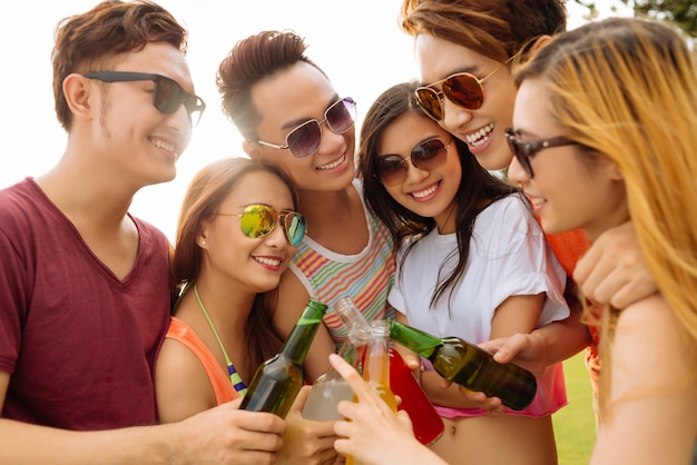 Toasting with beer bottles