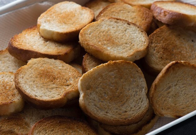 Toasts fried bread in a plate on wood background