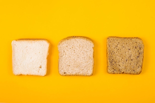 Photo toasts from different breads of different toast roasting on a bright yellow background