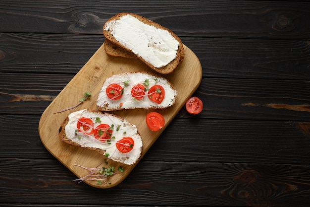 Toasts with microgreens on the table Healthy food vegan food and dieting concept