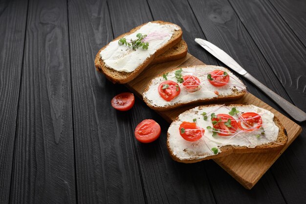 toasts with microgreens on the table healthy food vegan food and dieting concept