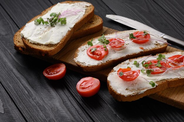 toasts with microgreens on the table healthy food vegan food and dieting concept
